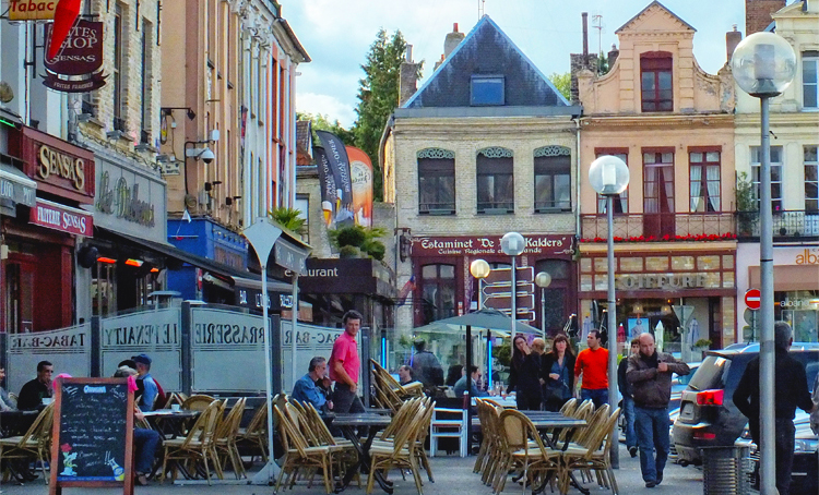 Colourful town square lined with restaurants and bars in Saint Omer